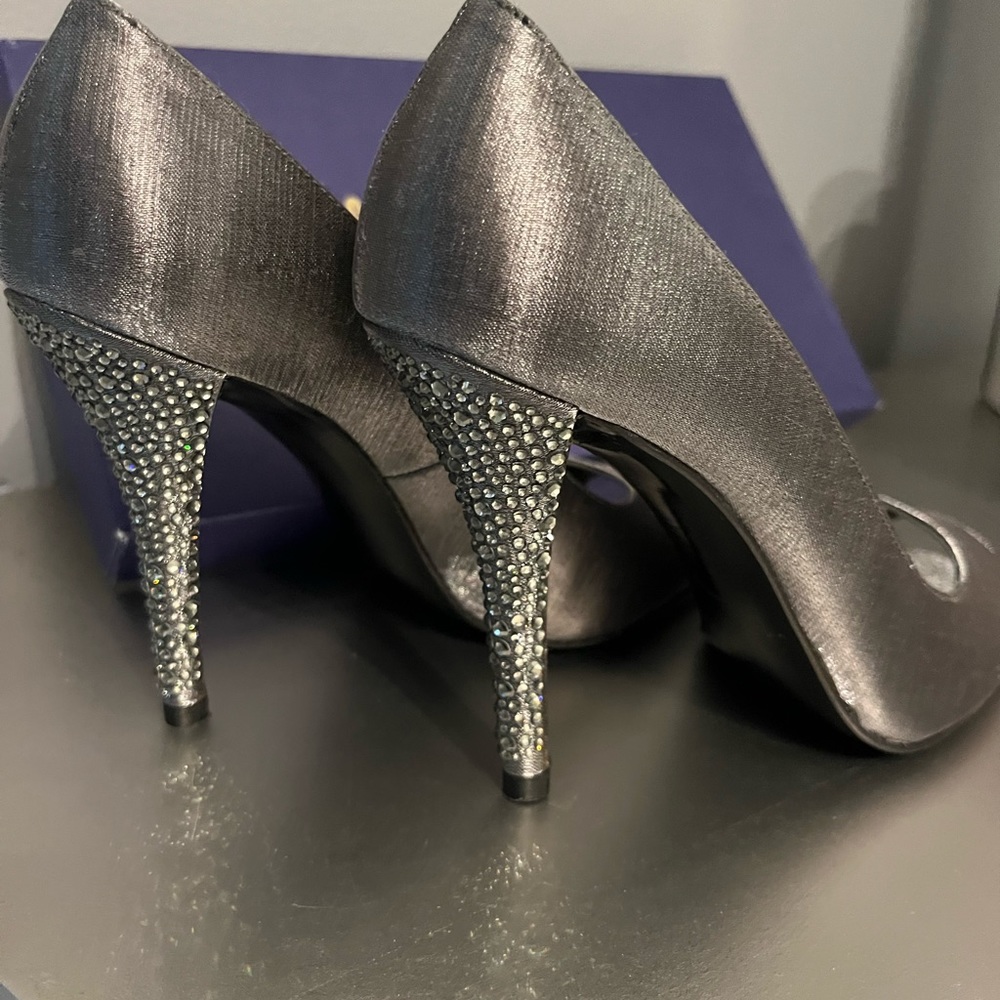 Showy Satin peep toe pump . Stewart Weitzman